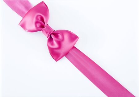 Pink Gift Ribbon Over White Backgroundの写真素材