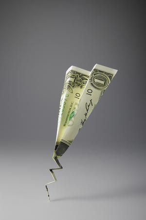 U.S. One Dollar Bill Folded Into A Paper Airplaneの写真素材