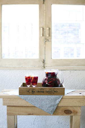 Mixed Alcoholic Drink In A Pitcher Next To Two Full Glassesのeditorial素材
