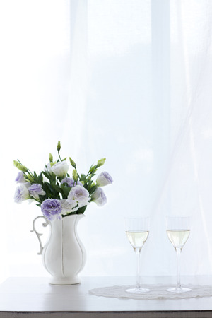Two Filled Wine Glasses By The Windowの写真素材