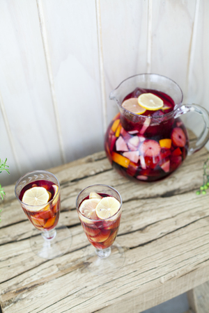 Mixed Alcoholic Drink In A Pitcher Next To Two Full Glassesの写真素材