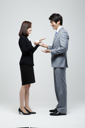 Male And Female Coworkers In Studio Settingの写真素材