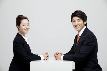 Male And Female Coworkers In Studio Settingの写真素材