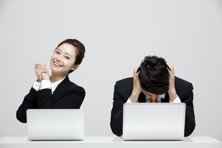 Male And Female Coworkers In Studio Settingの写真素材