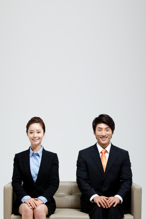 Male And Female Coworkers In Studio Settingの写真素材