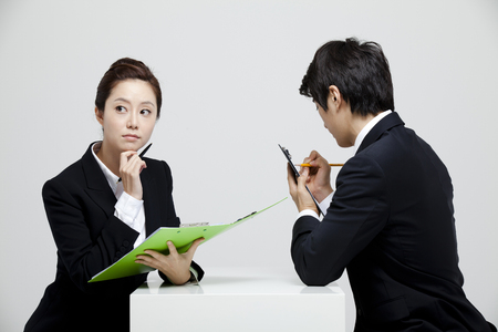 Male And Female Coworkers In Studio Settingの写真素材