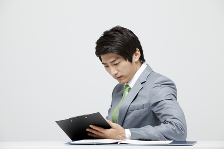 Studio Shot Of A Malcontent Male Company Employeeの写真素材