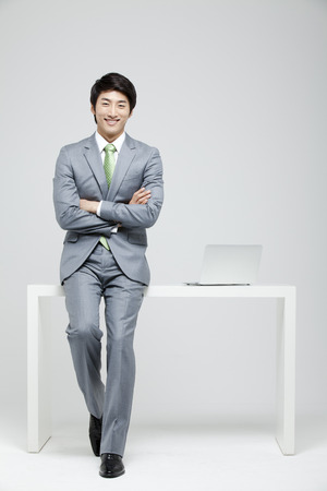 Young Businessman In Full Suit At The Deskの写真素材