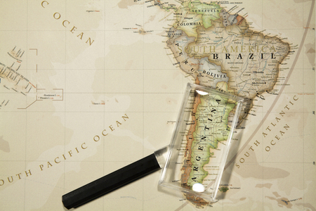 Magnifying Glass Placed On A World Mapのeditorial素材