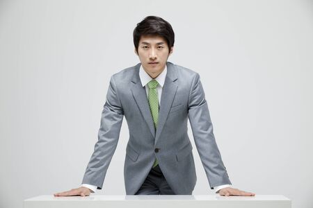Young Businessman In Full Suit At The Deskの写真素材