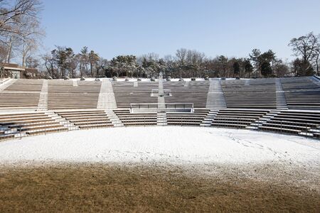 South Korea, Seoul, Children's Grand Park, Snow-covered outdoor chairs,の写真素材