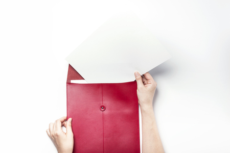 Red leather envelope-isolated on whiteの写真素材