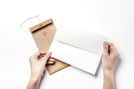 Beige leather envelope-isolated on whiteの写真素材