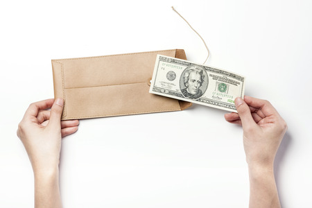 Beige leather envelope-isolated on whiteの写真素材