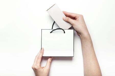 Close up shot of a white paper bag-isolated on whiteの写真素材