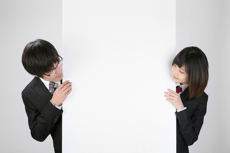 Asian students- Isolated on studio shotの写真素材