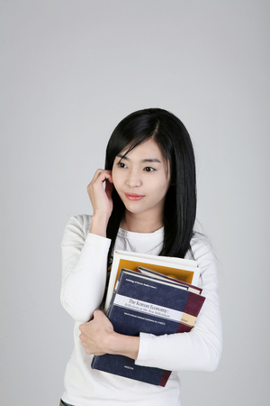 Asian students- Isolated on studio shotの写真素材