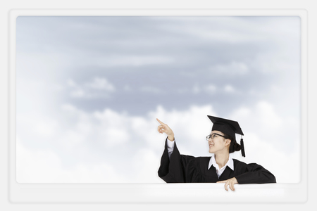 Asian girl in graduation gownの写真素材