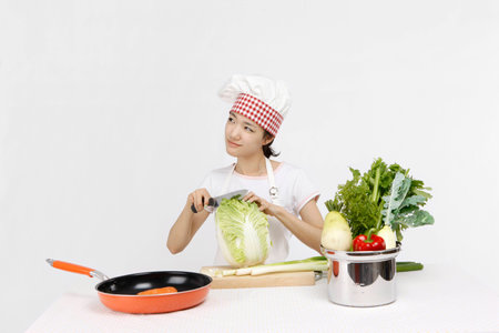 Asian students with cooking concept- Isolated on studio shotの写真素材