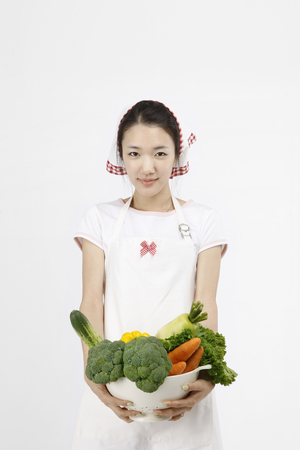Asian students with cooking concept- Isolated on studio shotの写真素材