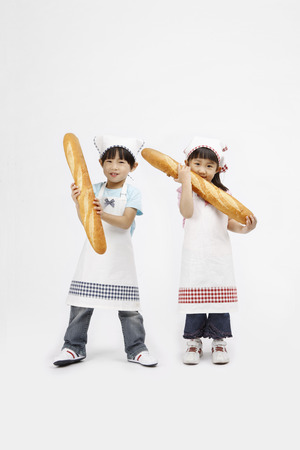 Asian kids with cooking concept - Isolated on studio shotの写真素材