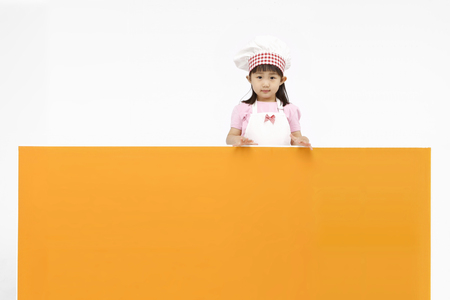 Asian kids with cooking concept- Isolated on studio shotの写真素材