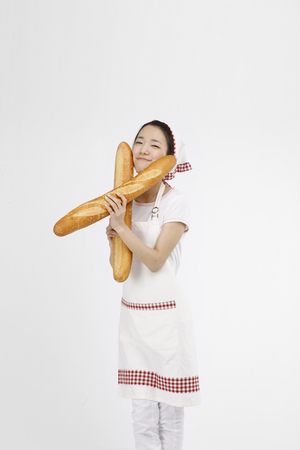 Asian students with cooking concept- Isolated on studio shotの写真素材