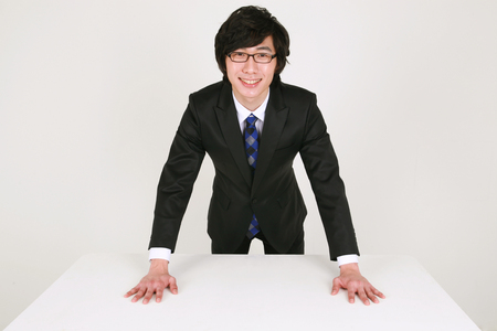 Asian business people in the studio - isolated on whiteの写真素材