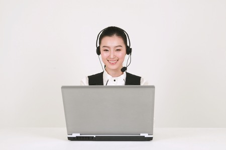 Asian business people in the studio - isolated on whiteの写真素材