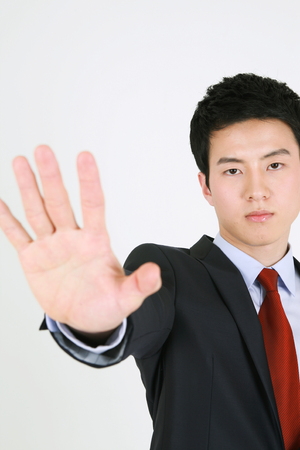 Asian business people in suit - isolated on whiteの写真素材