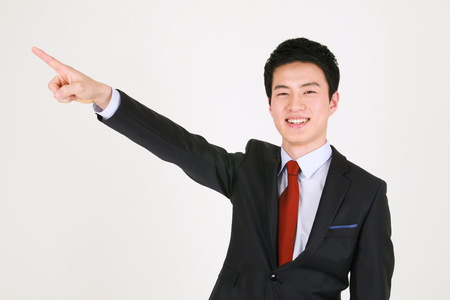 Asian business people in suit - isolated on whiteの写真素材