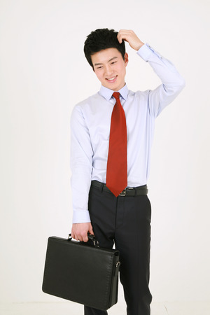 Asian business people in suit - isolated on whiteの写真素材