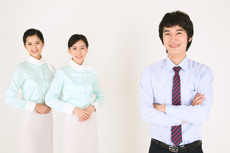 Asian flight attendants - isolated on whiteの写真素材