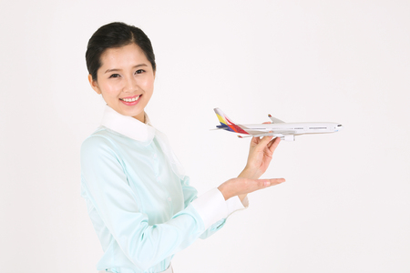 Asian flight attendants - isolated on whiteの写真素材