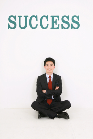 Asian business people - isolated on whiteの写真素材