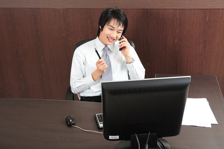 Young Asian business people at workの写真素材