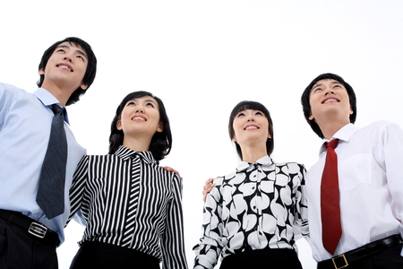 Young Asian business people - isolated on whiteの写真素材