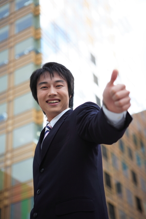 Young Asian business people outside the officeの写真素材