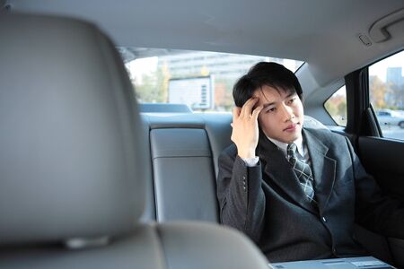 Young Asian business people outside the officeの写真素材