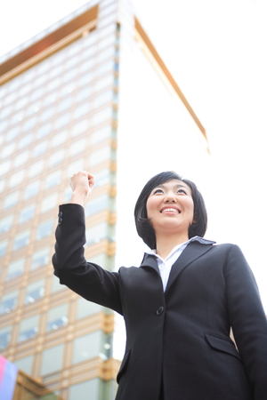 Young Asian business people outside the officeの写真素材