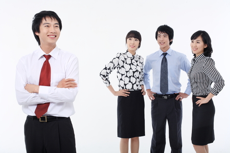 Young Asian business people - isolated on whiteの写真素材