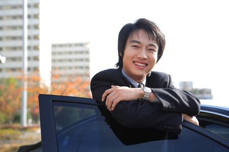 Young Asian business people outside the officeの写真素材