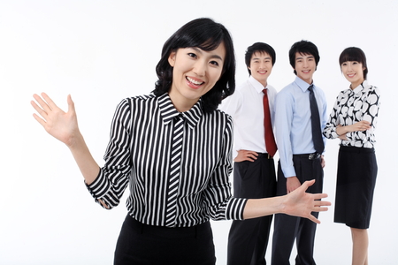 Young Asian business people - isolated on whiteの写真素材