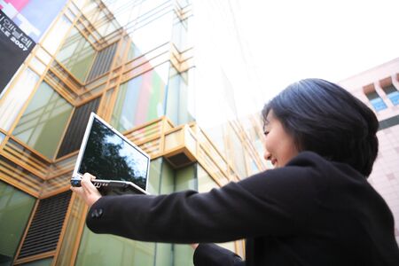 Young Asian business people outside the officeの写真素材