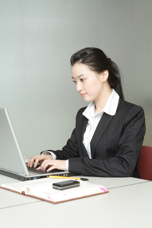 Young Asian business people working in an officeの写真素材