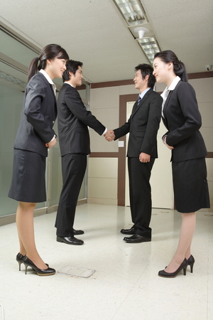 Young Asian business people working in an officeの写真素材