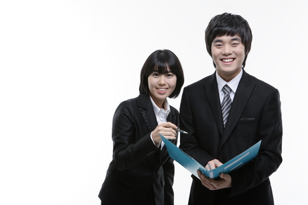 Young Asian business people - isolated on whiteの写真素材