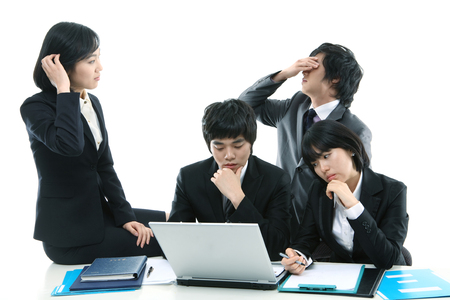 Young Asian business people - isolated on whiteの写真素材