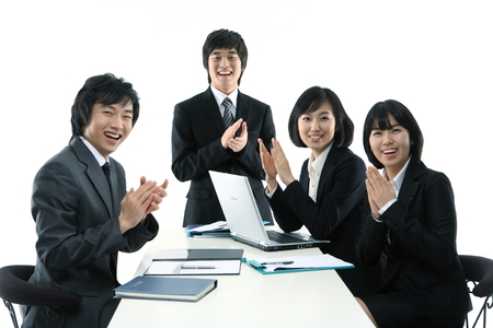 Young Asian business people - isolated on whiteの写真素材