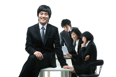Young Asian business people - isolated on whiteの写真素材